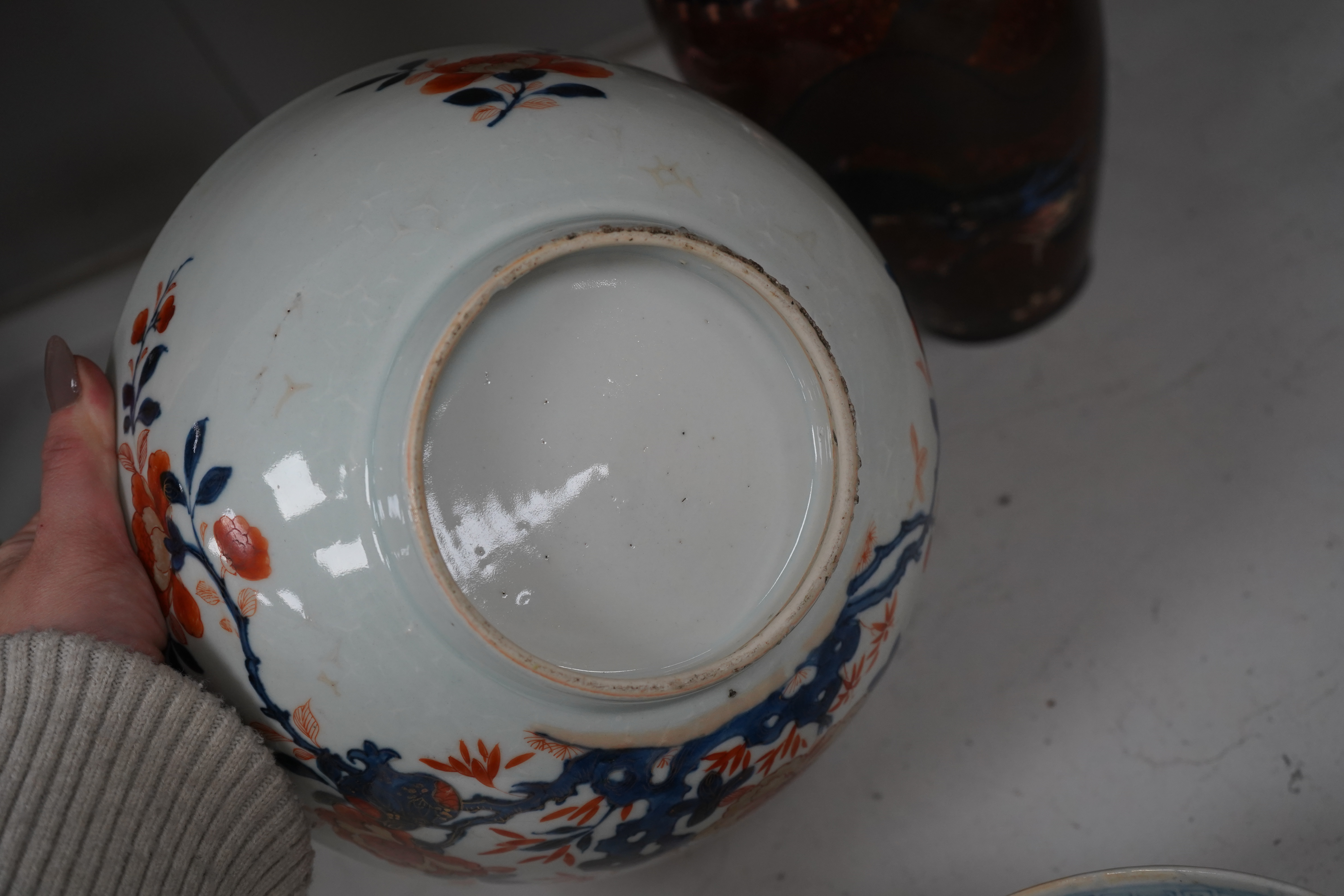 Three pieces of Chinese and Japanese ceramics to include an 18th century Chinese export bowl and a cloisonné ‘dragon’ vase, 31cm high. Condition - fair